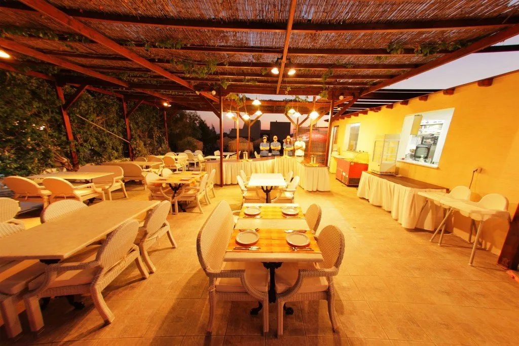 swimming pool with comfort chairs and umbrellas