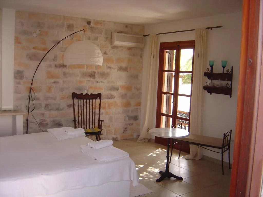 Room with one double bed and balcony